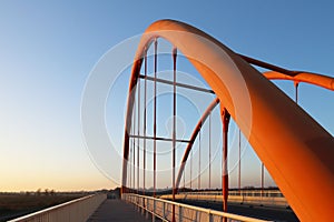 Rzeszow, Poland - 9 9 2018: Suspended road bridge across the autobahn. Metal construction technological structure. Modern