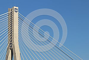 Rzeszow, Poland - 9 9 2018: Suspended road bridge across the Wislok River. Metal construction technological structure. Modern arch