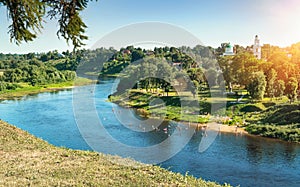 Rzhev, Russia, June 2021. Summer cityscape overlooking the Volga river with people on the bank