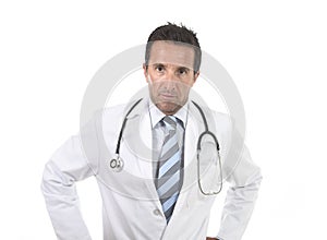 40s attractive male medicine doctor with stethoscope wearing medical gown in worried and stress