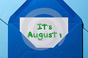 It`s August text in message at blue envelope