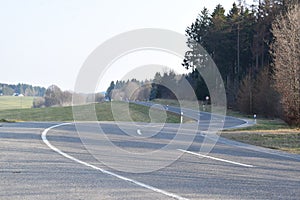 s-curve of an Eifel road near NÃ¼rburgring, tourist transfer route