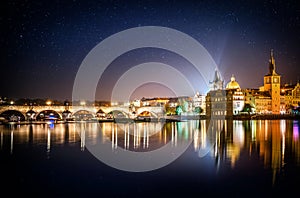 It`s evening in the city of Prague. View of the Charles bridge and star.