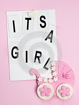 It`s a girl pink card. Newborn background. Baby shower invitation. Birth announcement. Flat lay