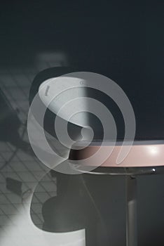 The mirror reflects sunlight on the wall