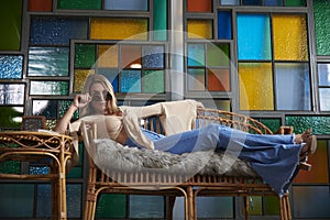 1960`s Sixties inspired shoot - woman in bell-bottom jeans photo