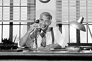 1950s smiling businessman on the phone