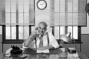 1950s smiling businessman on the phone