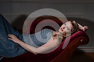 1940s style brunette on fainting couch photo