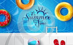 It`s summer time vector design. It`s summer time text with tropical fruit floaters, beach ball and flip flop on swimming pool.