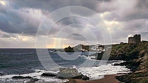 Sa mesquida beach in a stormy day, and old british defense tower, abandoned paradise beach in Menorca, a Spanish Mediterranean