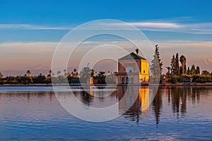 Saadian Pavillon at Menara gardens with Atlas mountains in Marrakech, Morocco