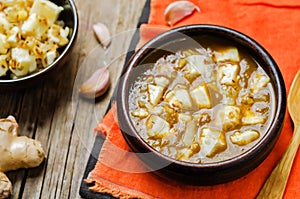 Saag Paneerin a bowl on a wood background