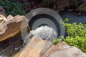 The Saar  mountain river with cold and crystal clear water flows in a crevice in the mountains of the Golan Heights in Israel