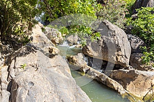 The Saar  mountain river with cold and crystal clear water flows in a crevice in the mountains of the Golan Heights in Israel