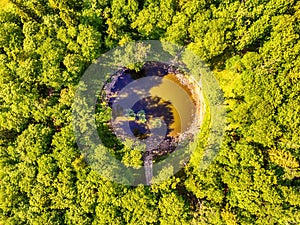 Saarema Island, Estonia: aerial top view the main meteorite crater in the village of Kaali