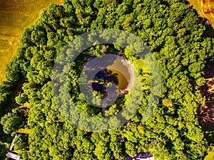 Saarema Island, Estonia: aerial top view the main meteorite crater in the village of Kaali photo