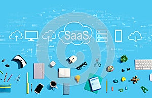 SaaS - software as a service concept with electronic gadgets and office supplies