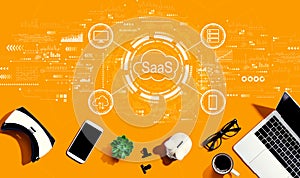 SaaS - software as a service concept with electronic gadgets and office supplies