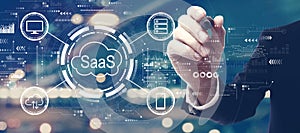 SaaS - software as a service concept with a man on city background