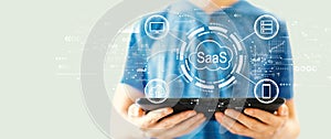SaaS - software as a service concept with man using a tablet