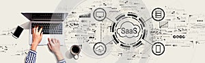 SaaS - software as a service concept with person using laptop