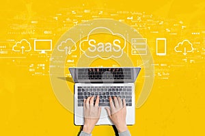 SaaS - software as a service concept with person using laptop