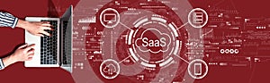 SaaS - software as a service concept with person using a laptop