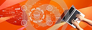 SaaS - software as a service concept with person using a laptop