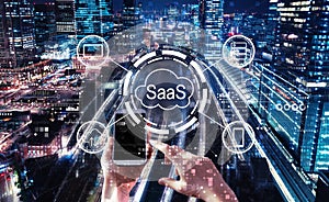 SaaS - software as a service concept with person using smartphone