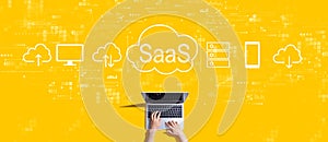 SaaS - software as a service concept with person working with laptop