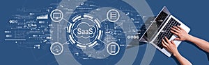 SaaS - software as a service concept with woman using a laptop