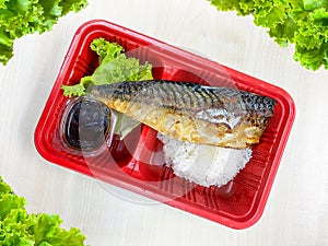 Saba fish grilled with salad in the food container