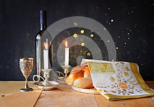 Sabbath image. challah bread and candelas on wooden table