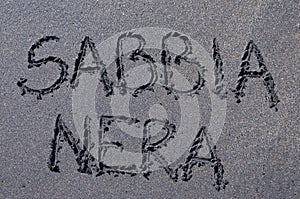 Sabbia Nera black sand inscription drawn on black sand photo