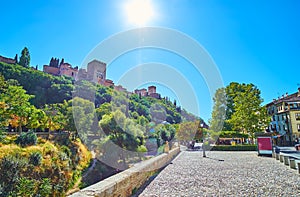 The Sabika Hill and Alhambra from Paseo de los Tristes Street, Albaicin, Granada, Spain photo