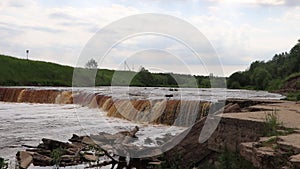 Sablinsky waterfalls. Little waterfall. The brown water of the waterfall. Thresholds on the river. Strong water flow. Jets of wate