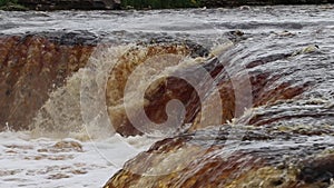 Sablinsky waterfalls. Little waterfall. The brown water of the waterfall. Thresholds on the river. Strong water flow. Jets of wate