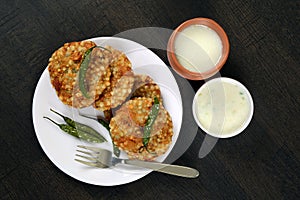 Sabudana vada with fried green chili, Sago cutlet and chutney and butter milk