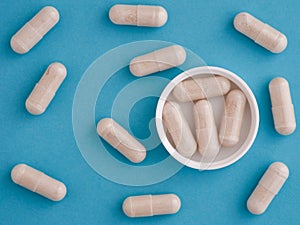 Saccharomyces boulardii capsules in a cap with other capsules around them