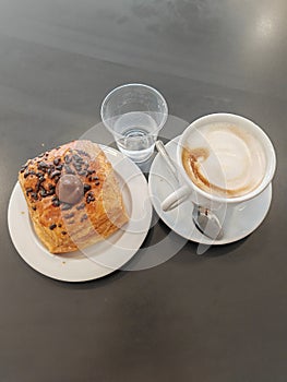 Saccottino with nutella pastry and cappuccino milk and coffee, italian breakfast