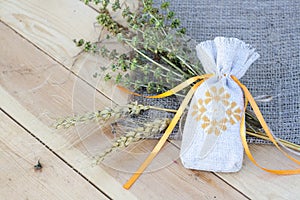 Sachet with ukrainian embroidery, sheaf of wheat and dried herbs