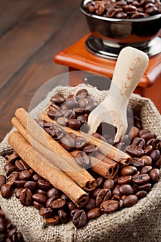 Sack with coffee beans and coffee grinder