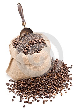 Sack of coffee beans with retro scoop isolated on white