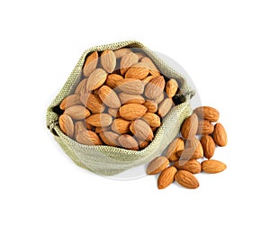 Sack and organic almond nuts on white background, top view. Healthy snack