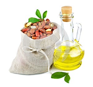 Sack of peanut and glass bottle of oil with leaves