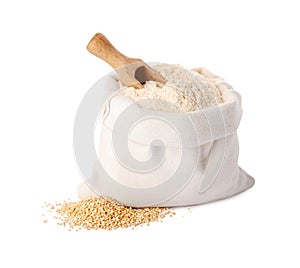 Sack with quinoa flour, scoop and seeds on white background