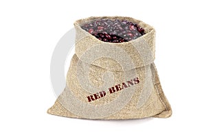 A sack of red kidney beans isolated on a white background. Haricot beans in burlap saks. Kidney beans in jute bag