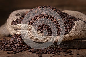 Sack of spilled roasted coffee beans