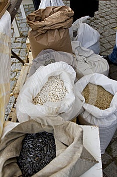 Sacks full with chickpeas, beans, buckwheat, millet, wheat, spelled, lentils, Einkorn wheat grains. Variety of beans, grains and s